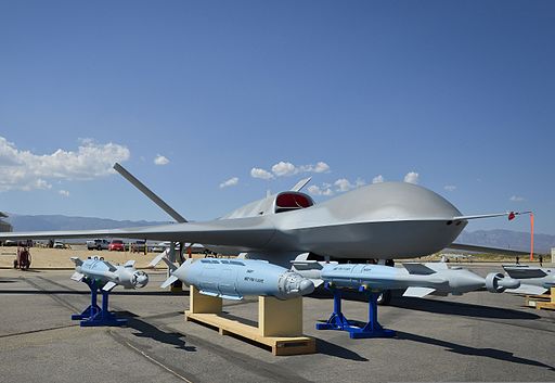 A_Predator_C_Avenger_unmanned_aircraft_system_and_inert_ordnance_sit_on_display_on_a_tarmac_at_Palmdale,_Calif.,_Aug._8,_2012_120808-N-WL43.jpg