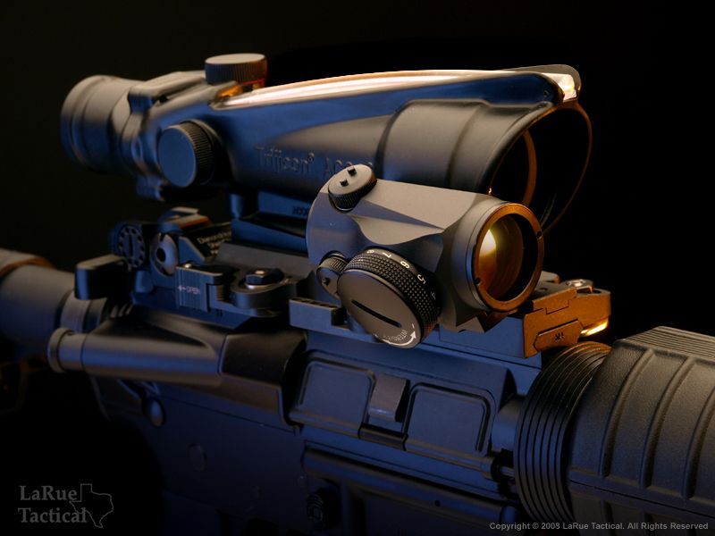 The ACOG is fixed power, so for CQB the rifle is rotated and the offset red-dot is used..jpg
